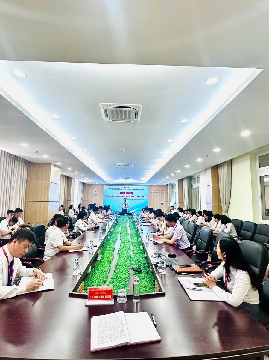 A group of people sitting at a long tableAI-generated content may be incorrect.
